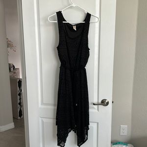 Knee length handkerchief bottom black dress with suede braided belt